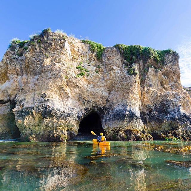 Photo of kayaker in Dinosaur Caves in Shell Beach.