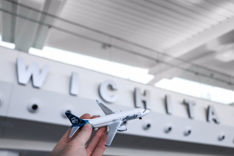 Photo of a mini plane in front of the word "Wichita"